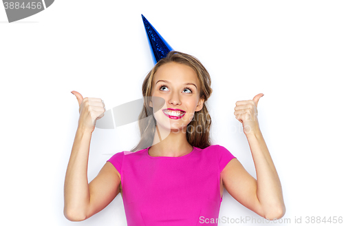 Image of happy young woman or teen girl in party cap