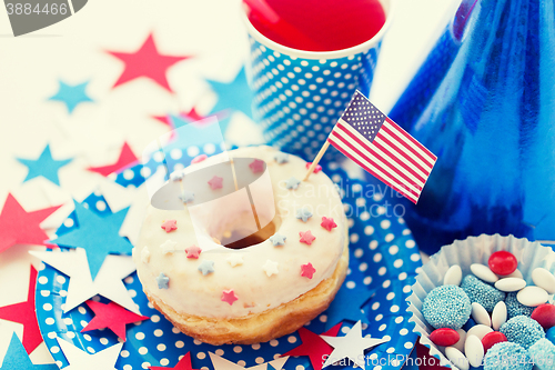 Image of donut with juice and candies on independence day