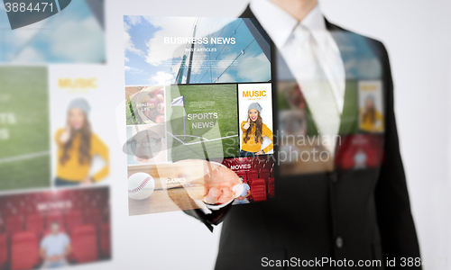 Image of close up of man hand showing web news projection