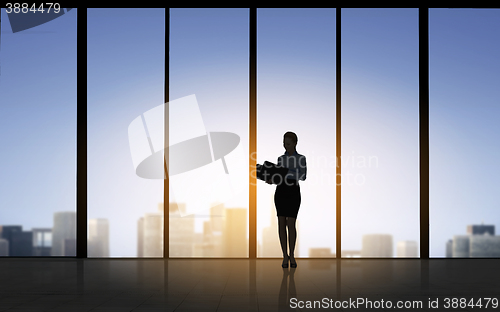 Image of silhouette of business woman with folders