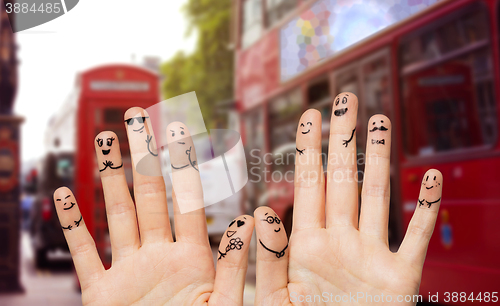 Image of close up of fingers with smiley faces wedding