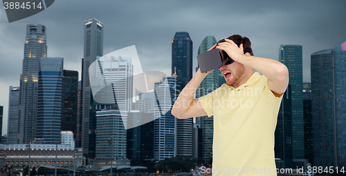 Image of happy man in virtual reality headset or 3d glasses