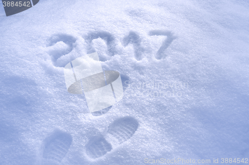 Image of New Year 2017 greeting, footprints in snow, new year 2017, 2017 greeting card