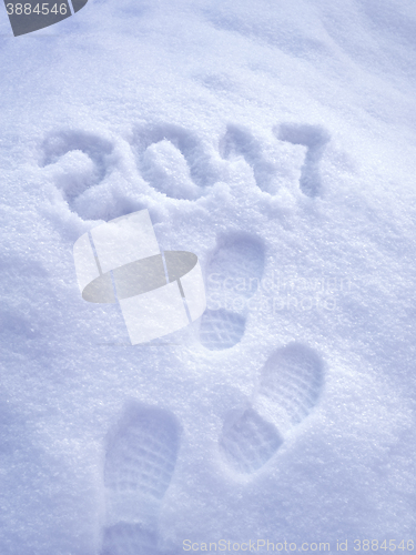 Image of 2017 New Year greeting card, 2017 new year, foot step prints in snow, happy new year 2017 concept