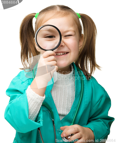 Image of Cute little girl is playing doctor