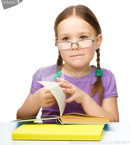 Image of Little girl with books