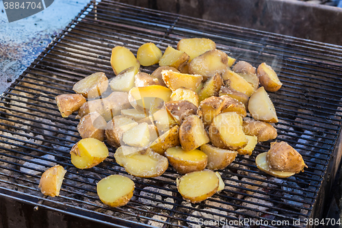 Image of Roasted potatoes on barbeque.