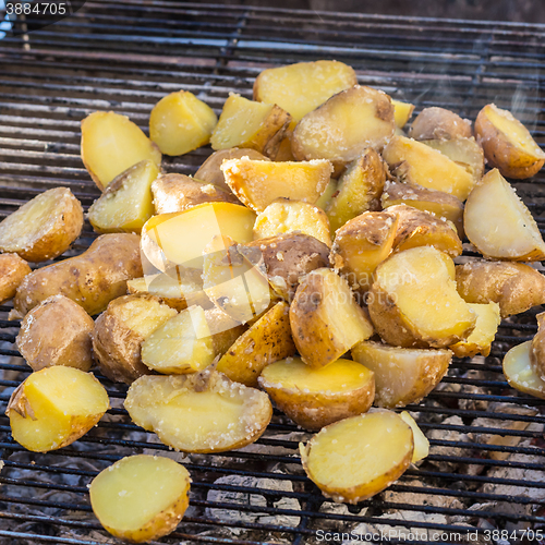 Image of Roasted potatoes on barbeque.