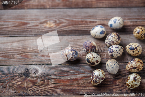 Image of Group of quail eggs on thewooden background