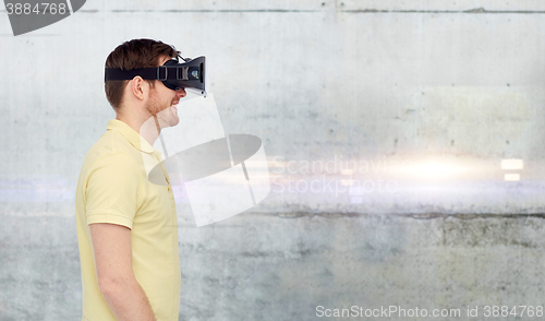 Image of happy man in virtual reality headset or 3d glasses