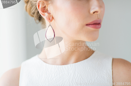 Image of close up of beautiful woman face with earring