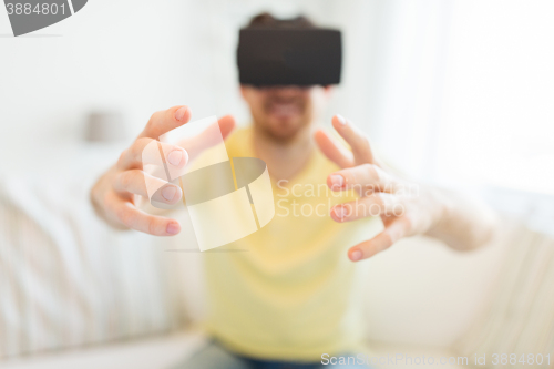 Image of young man in virtual reality headset or 3d glasses