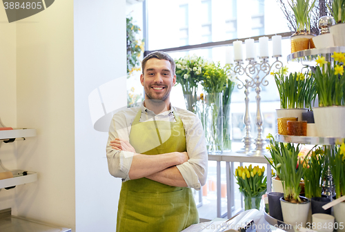 Image of florist man or seller at flower shop counter