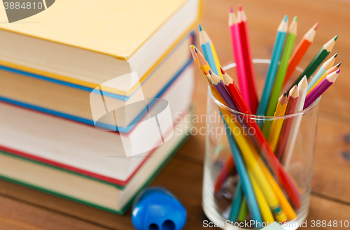 Image of close up of crayons or color pencils and books