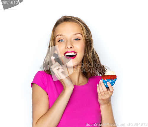 Image of happy woman or teen girl with birthday cupcake