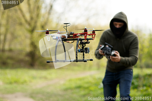 Image of Man flying with the drone
