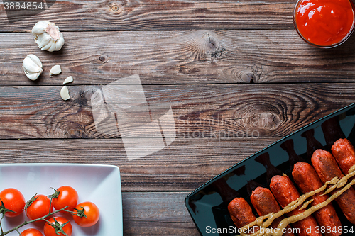 Image of Sausage roasted on the grill.