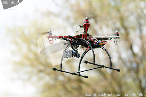 Image of Quadrocopter while flying in the forest. 