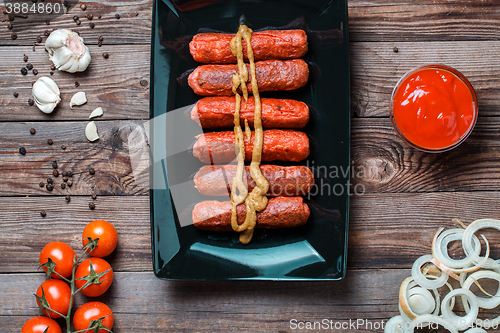 Image of Sausage roasted on the grill.