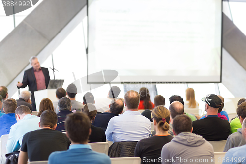 Image of Male speeker having talk at public event.