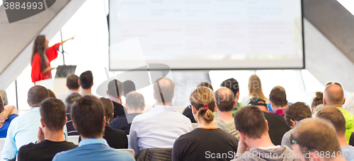 Image of Female speeker having talk at public event.