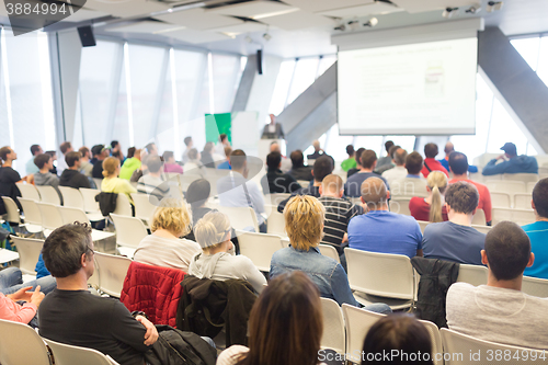 Image of Male speeker having talk at public event.