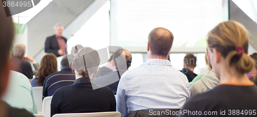 Image of Male speeker having talk at public event.