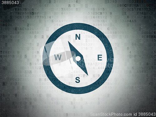 Image of Vacation concept: Compass on Digital Data Paper background