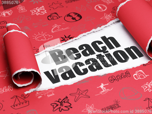 Image of Travel concept: black text Beach Vacation under the piece of  torn paper