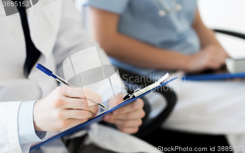 Image of close up of happy doctors at seminar or hospital