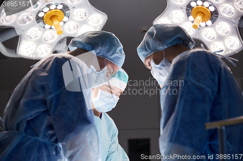 Image of group of surgeons in operating room at hospital