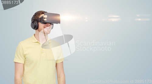 Image of happy man in virtual reality headset or 3d glasses