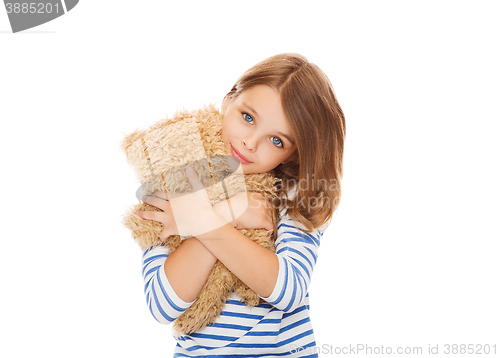 Image of cute little girl hugging teddy bear