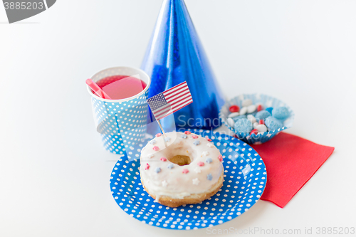 Image of donut with juice and candies on independence day