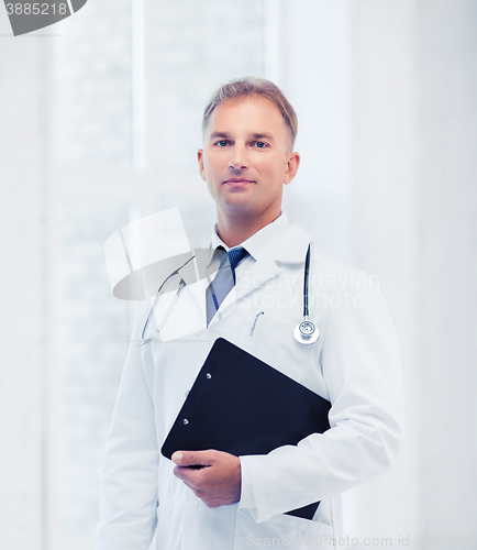 Image of male doctor with stethoscope and notes