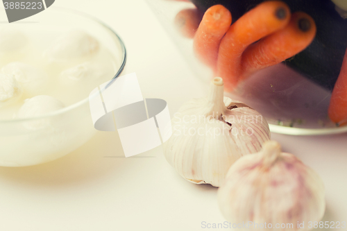 Image of close up of garlic, carrot and mozzarella cheese