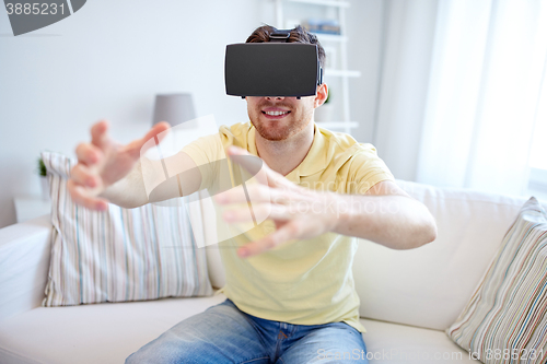 Image of young man in virtual reality headset or 3d glasses
