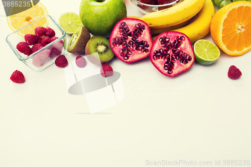 Image of close up of fresh fruits and berries on table