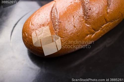 Image of baking fresh bread in the bakehouse