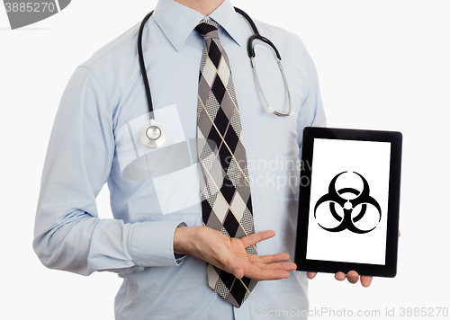 Image of Doctor holding tablet - Warning! Biohazard!