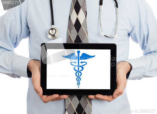 Image of Doctor holding tablet - Caduceus symbol
