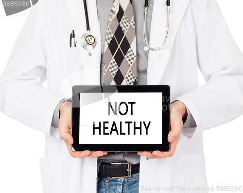 Image of Doctor holding tablet - Not healthy