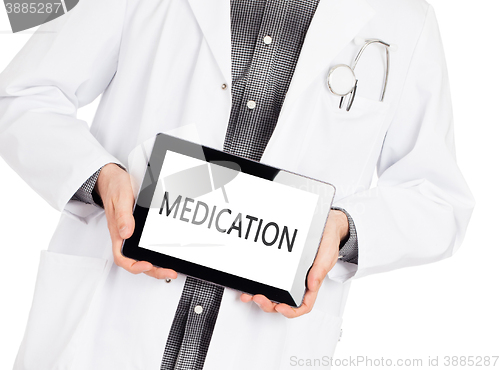 Image of Doctor holding tablet - Medication