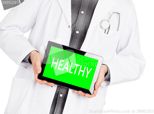 Image of Doctor holding tablet - Healthy