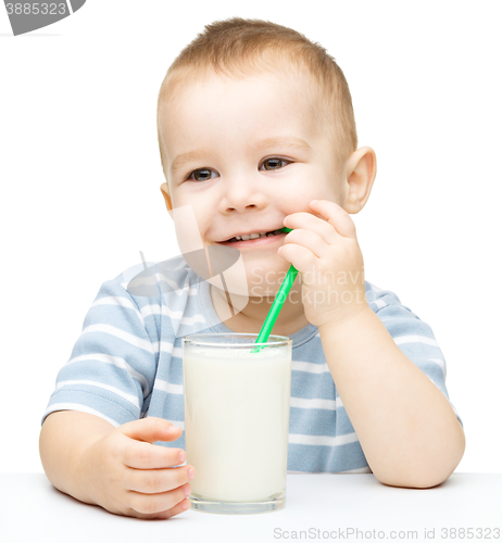 Image of Cute little boy with a glass of milk