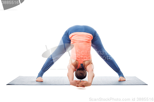 Image of Woman practices Ashtanga Vinyasa yoga asana