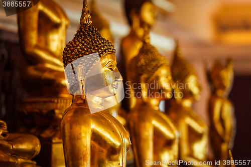 Image of Golden Buddha statues in buddhist temple