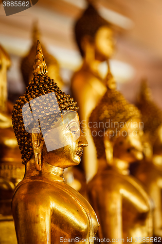 Image of Golden Buddha statues in buddhist temple