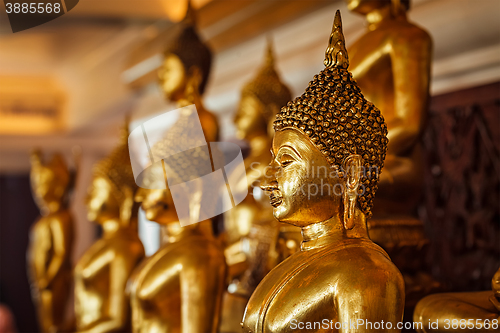 Image of Golden Buddha statues in buddhist temple