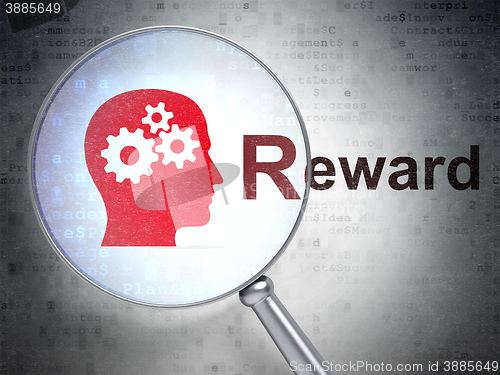 Image of Finance concept: Head With Gears and Reward with optical glass